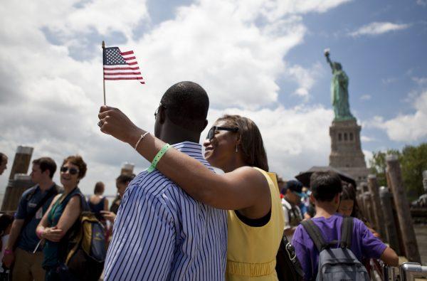 Visitors on Liberty Island on July 4, 2013. (Samira Bouaou/Epoch Times)