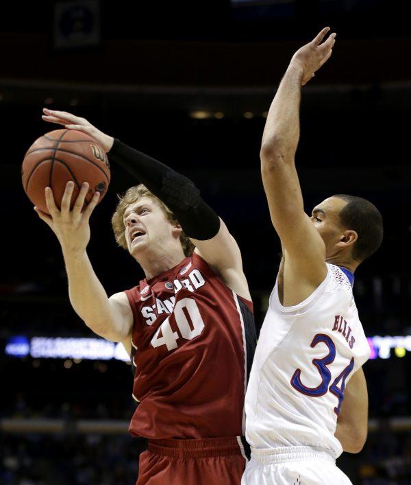 Stanford's John Gage (40) shoots under pressure from Kansas's Perry Ellis (34) during the first half of a third-round game at the NCAA college basketball tournament  March 23, 2014, in St. Louis. (Charlie Riedel/AP Photo)