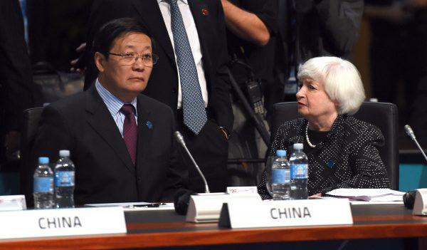 Chinese Finance Minister Lou Jiwei talks with U.S. Federal Reserve Chair Janet Yellen at the G20 Finance Ministers and Central Bank Governors Meeting in Cairns, Australia, on Sept. 20, 2014. (William West/AFP/Getty Images)