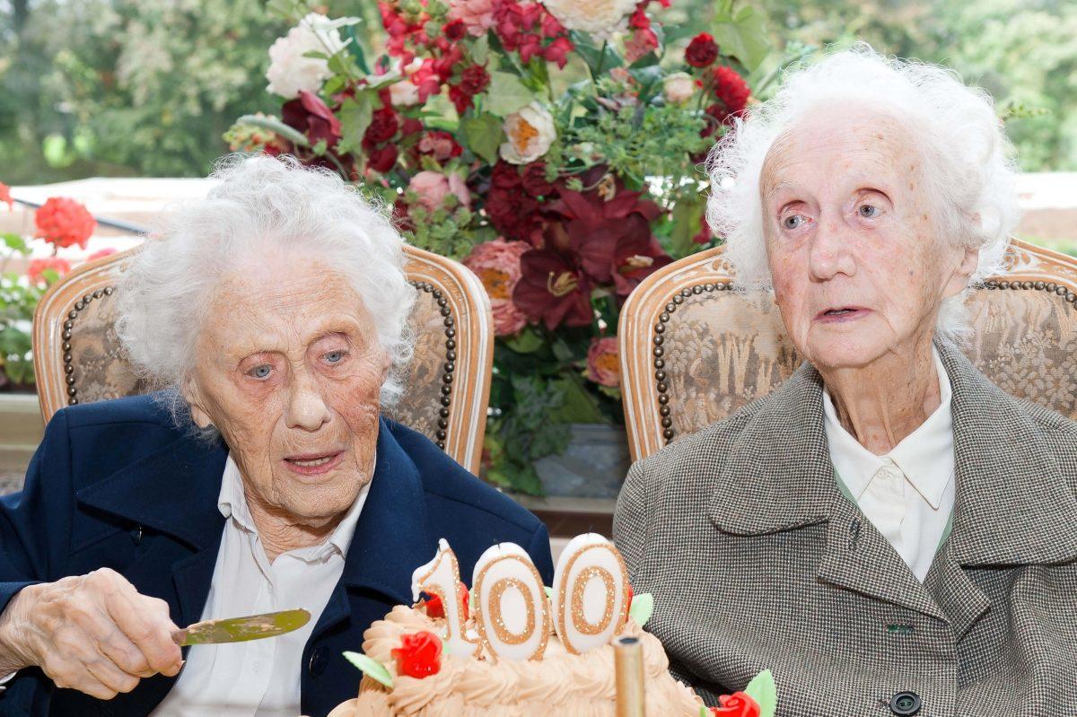 Marie Hendrix (L) and Gabrielle Vaudremer, 100-year-old Belgian twins, celebrate their birthday. (Nicolas Lambert/AFP/Getty Images)