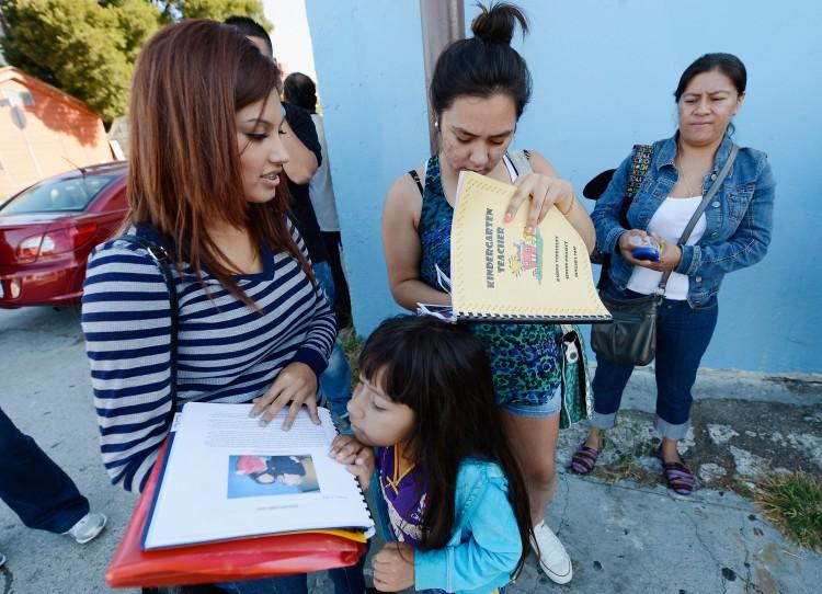 Applicants wait in line with hundreds of fellow undocumented immigrants at the Coalition for Humane Immigrant Rights offices to apply for deportation reprieve in Los Angeles on Aug. 15, 2012. (Kevork Djansezian/Getty Images)