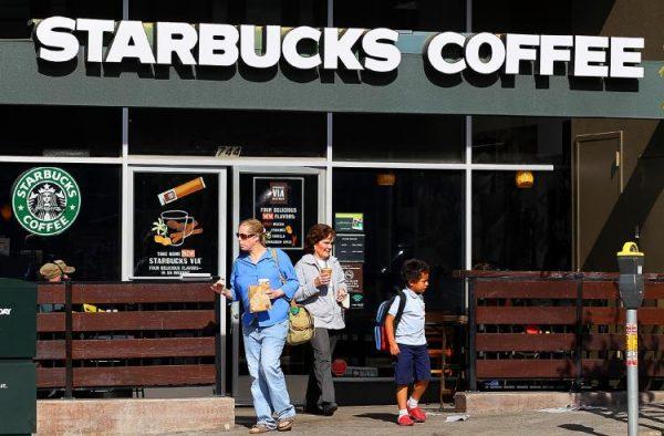 Customers leave a Starbucks in San Francisco. (Justin Sullivan/Getty Images)