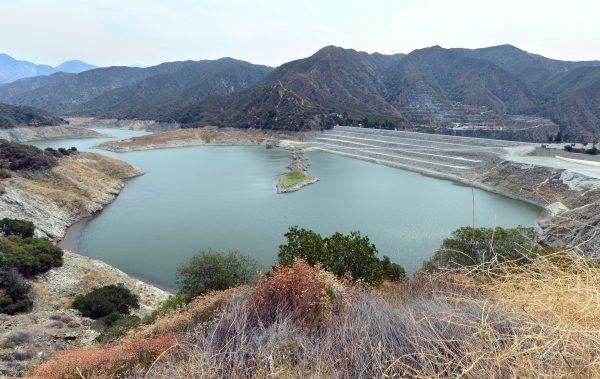 Receding water levels can be seen around the San Gabriel Reservoir, or San Gabriel Dam, which provides flood control, groundwater recharge flows and hydroelectricity for the heavily populated San Gabriel Valley in the Greater Los Angeles metropolitan area, which lies in the San Gabriel Mountains north of Azusa, Calif., and east of Los Angeles, on July 29, 2014. (Frederic J. Brown/AFP/Getty Images)