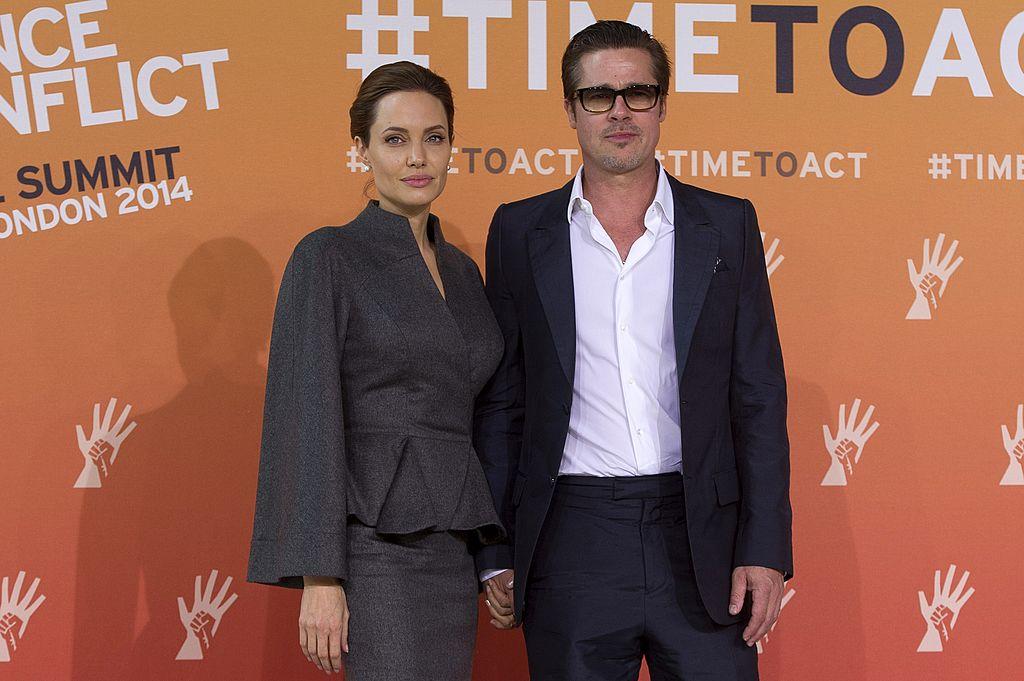 Brad Pitt and his wife Angelina Jolie at the Global Summit to End Sexual Violence in Conflict in London on June 13, 2014. (Carl Court/AFP/Getty Images)