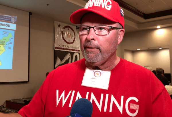 Dane Senser, wearing a "WINNING" shirt, attends the second New California State Convention in Irvine, Calif. on Oct. 6, 2018. (David Zhang/The Epoch Times)