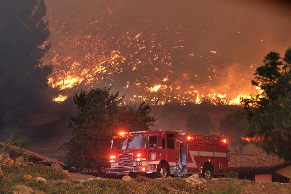 Firefighters from various departments work to protect structures as the Woolsey Fire moves through the property on Cornell Road near Paramount Ranch in Agoura Hills, Calif. on Nov. 9, 2018. (Photo by Matthew Simmons/Getty Images)