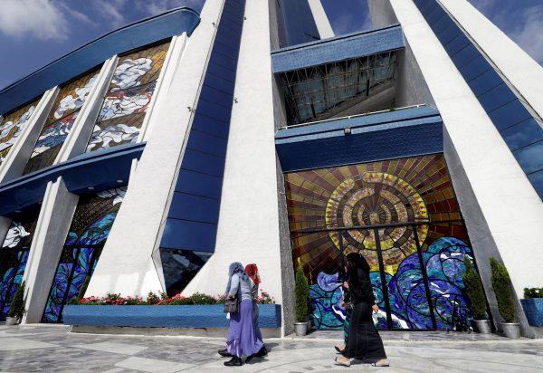 Devotees walk outside a La Luz del Mundo (The Light of the World) church after its leader Naason Joaquin Garcia was arrested in California, in Mexico City, Mexico June 5, 2019. (Luis Cortes/Reuters)
