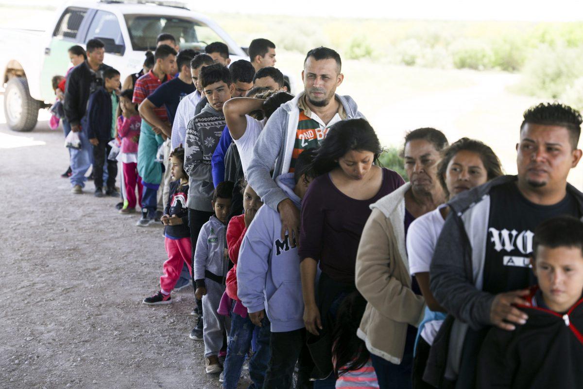 Border Patrol apprehends illegal aliens who have just crossed the Rio Grande from Mexico near McAllen, Texas, on April 18, 2019. (Charlotte Cuthbertson/The Epoch Times)