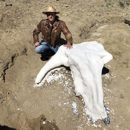 Michael Kjelland poses with Alice after she has been treated with foil and plaster for protection. (UC Merced)