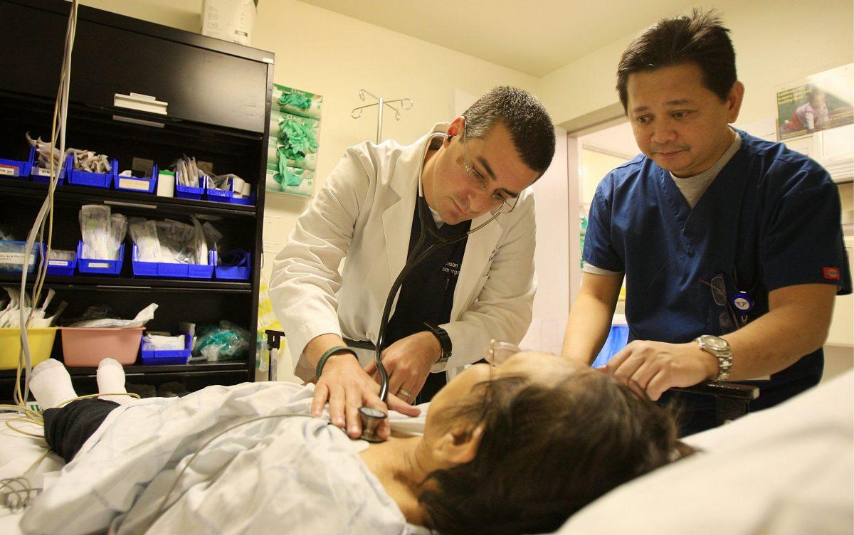 A doctor and emergency room nurse treat a patient at Mission Community Hospital in Panorama City, Calif., on Jan. 28, 2009. (David McNew/Getty Images)