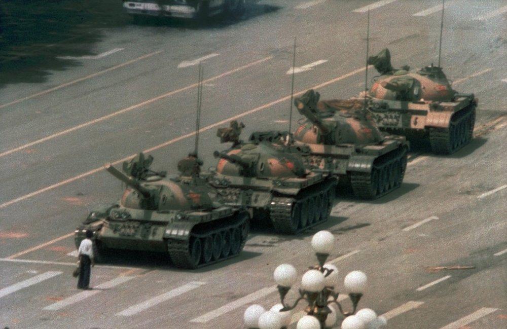 A Chinese man stands alone to block a line of tanks heading east on Beijing's Changan Boulevard on June 5, 1989. (AP Photo/Jeff Widener, File)