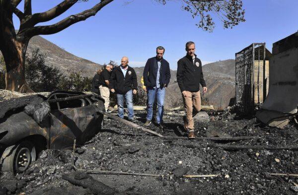 LA City Councilman Mike Bonin (L), California Gov. Gavin Newsom (C), and LA City Mayor Eric Garcetti (R) tour a burned home in Brentwood, Calif., on Oct. 29, 2019. (Wally Skalij/Pool via Getty Images)