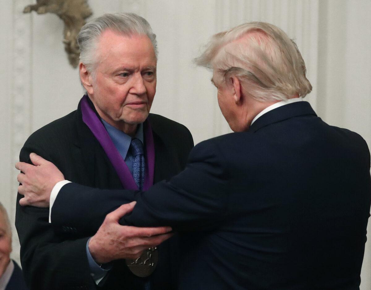 President Donald Trump (R) presents actor Jon Voight with the National Medal of Arts at a ceremony in the East Room of the White House on Nov. 21, 2019. (Mark Wilson/Getty Images)