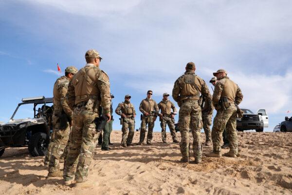 Border Patrol BORSTAR agents debrief after tending to an injured man who crashed his Polaris RZR sand car in the Imperial Sand Dunes near the U.S.-Mexico border, Calif., on Nov. 30, 2019. (Charlotte Cuthbertson/The Epoch Times)