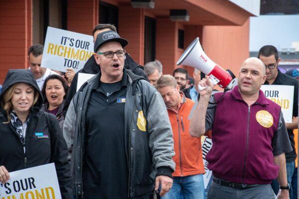 Local 3 Director of Government Relations Chris Snyder holds a megaphone and directs workers and supporters during the Rally for Jobs outside Richmond City Hall. (Courtesy of Operating Engineers Local 3)