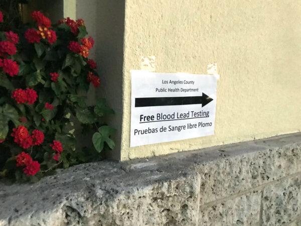 A sign on the wall of Resurrection Church advertises blood testing for high levels of lead in Los Angeles on Jan. 31, 2020. (Chris Karr/The Epoch Times)