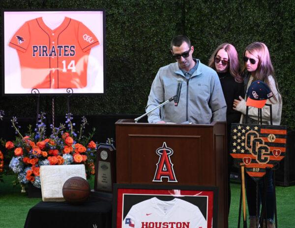 J.J. Altobelli, his fiance Carly Konigsfeld, and his sister Lexi Altobelli, speak during a memorial service honoring John, Keri, and Alyssa Altobelli at Angel Stadium in Anaheim, Calif., on Feb. 10, 2020. (Jayne Kamin-Oncea/Getty Images)