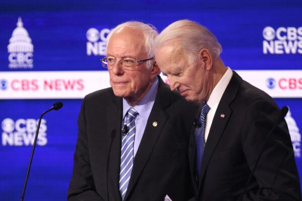 Democratic presidential candidates Sen. Bernie Sanders (I-VT) and former Vice President Joe Biden speak during a break at the Democratic presidential primary debate at the Charleston Gaillard Center on Feb. 25, 2020 in Charleston, S.C. (Win McNamee/Getty Images)