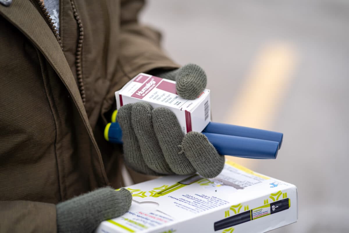 An individual holds insulin medicine in Minnetonka, Minn., on Jan. 17, 2020. (Kerem Yucel/AFP via Getty Images)