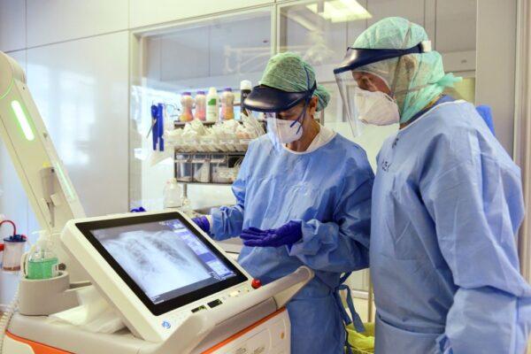 Medical staff look at the scan of a patient's lungs at the Intensive Care Unit (ICU) hosting the COVID-19 patients at the ASST Papa Giovanni XXIII hospital in Bergamo, Italy, on April 3, 2020. (Piero Cruciatti/AFP via Getty Images)