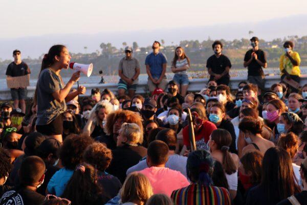 A woman speaks at a protest, calling for justice in the case of George Floyd, in Newport Beach, Calif., on June 3, 2020. (Jamie Joseph/The Epoch Times)
