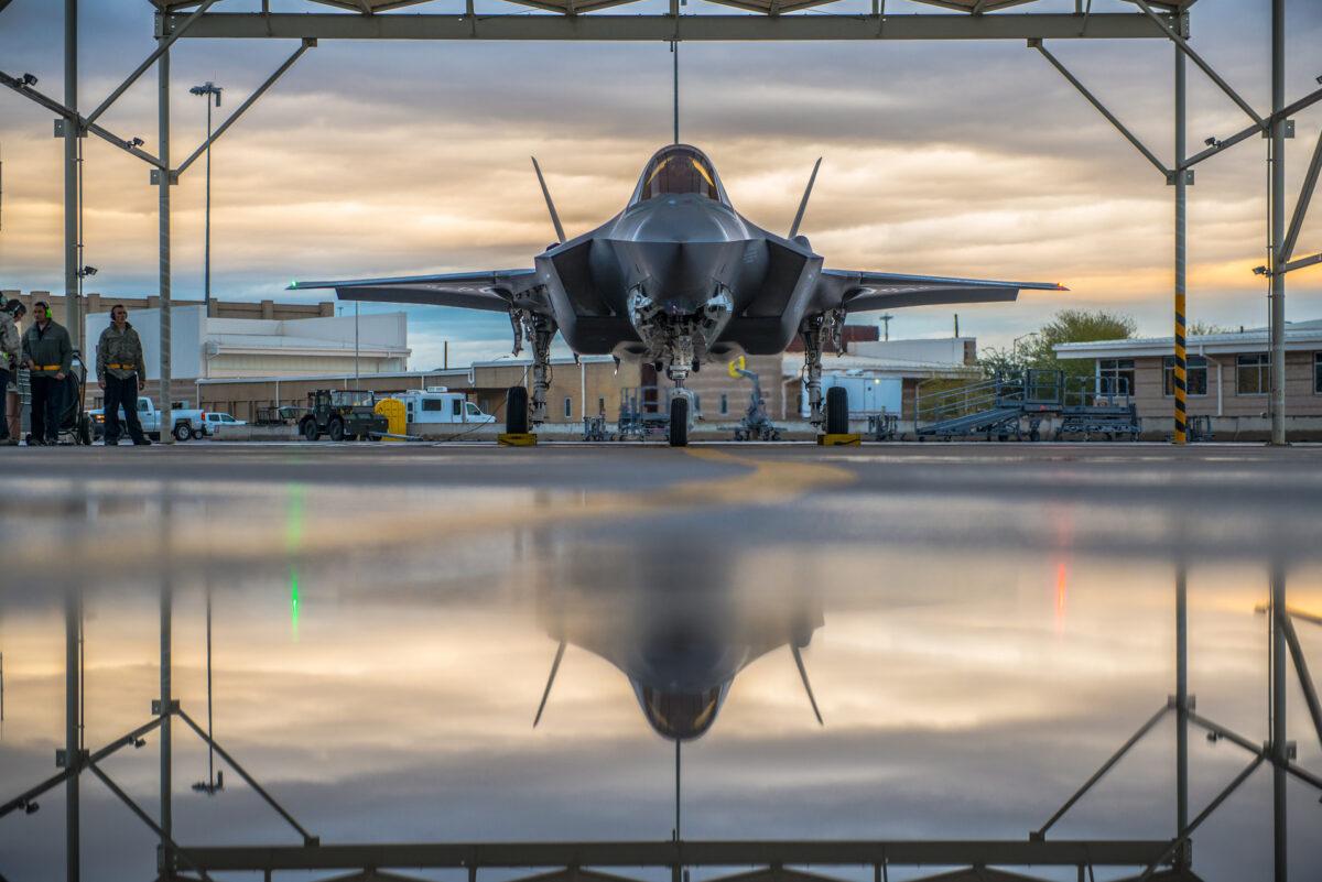 A pilot assigned to the 61st Fighter Squadron and 61st Aircraft Maintenance Unit crew chiefs prepare an F-35A Lightning II for taxi at Luke Air Force Base, Ariz., on Jan. 15, 2019. (Airman 1st Class Jacob Wongwai/U.S Air Force)