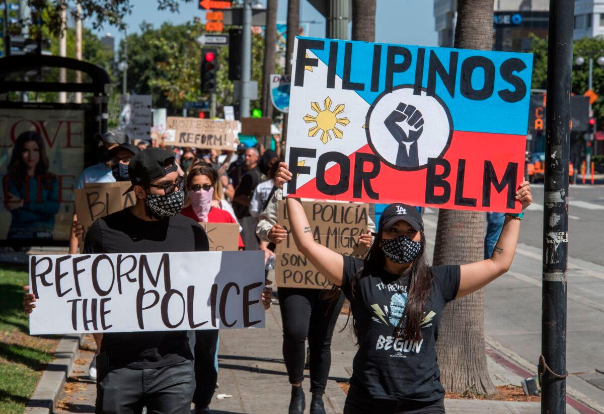 Supporters of Black Lives Matter march outside the Los Angeles Police Department headquarters in Los Angeles, Calif., on June 7, 2020. (Mark Ralston/AFP via Getty Images)