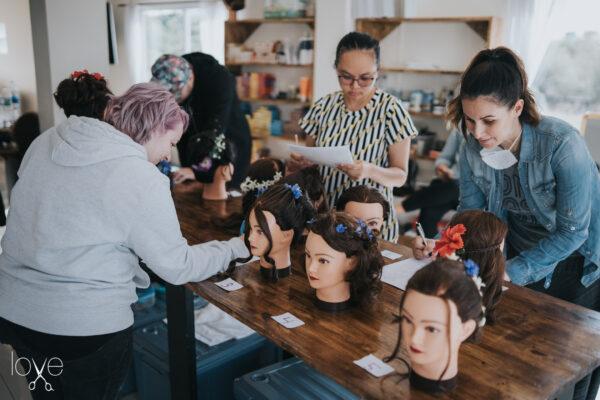 Dianna Bautista (R) works with others at Shear Love in Pattaya, Thailand. (Courtesy of Shear Love)