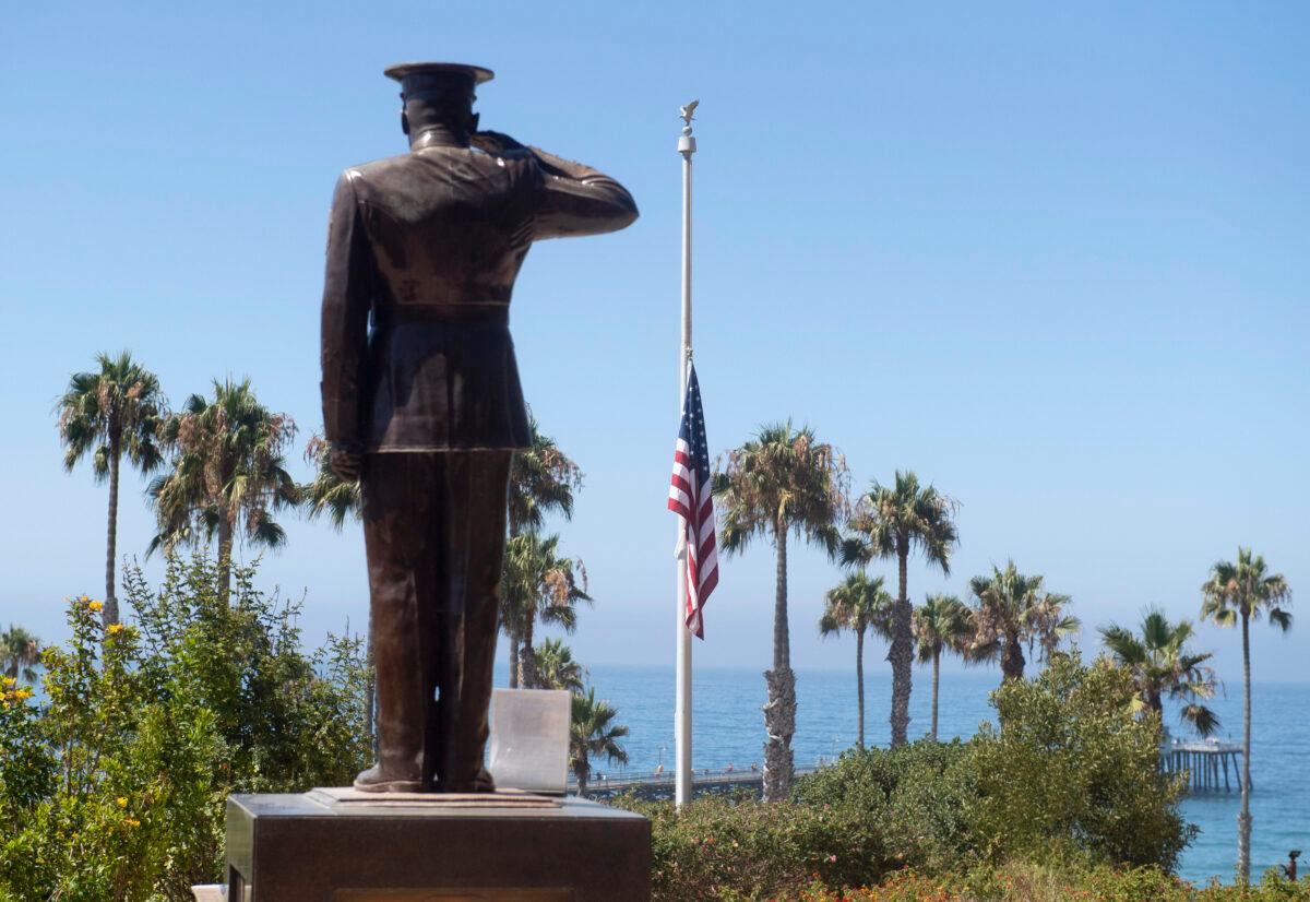 The U.S. flag was lowered to half-staff at Park Semper Fi in San Clemente, Calif., on July 31, 2020. (Paul Bersebach/The Orange County Register via AP)