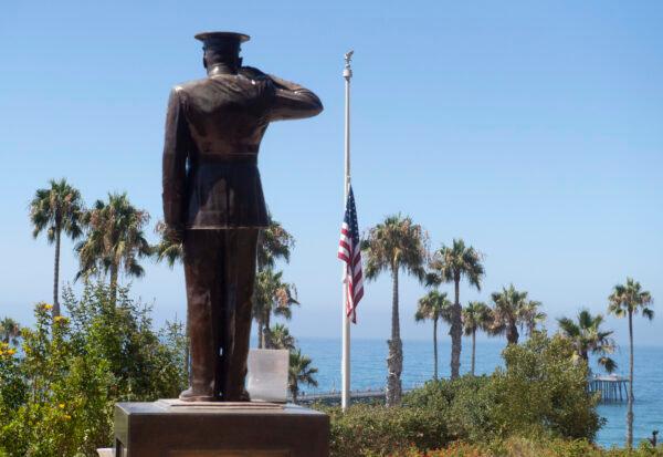 The U.S. flag was lowered to half-staff at Park Semper Fi in San Clemente, Calif., on July 31, 2020. (Paul Bersebach/The Orange County Register via AP)