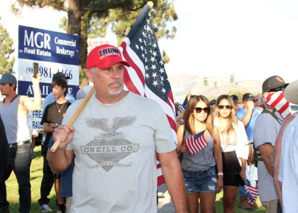 Counterprotesters line the street alongside a Black Lives Matter demonstration in Yucaipa, Calif., on Aug. 1, 2020. (Brad Jones/The Epoch Times)