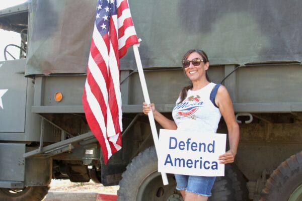 Christine Beamer stands among counterprotesters in Yucaipa, Calif., on Aug. 1, 2020. (Brad Jones/The Epoch Times)