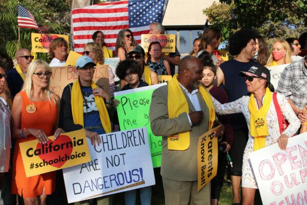 Parents assemble at a rally calling for the reopening of Orange County schools in Santa Ana, Calif., on Aug. 4, 2020. (Jamie Joseph/The Epoch Times)