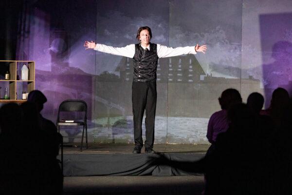 An actor spreads his arms during an outdoor performance of the musical "Jekyll & Hyde" in Costa Mesa, Calif., on Aug. 5, 2020. (John Fredricks/The Epoch Times)
