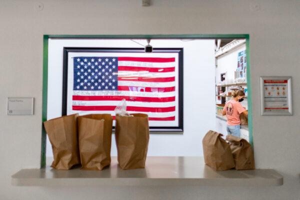 Food bags are prepared for pick-up at Share Our Selves food pantry in Costa Mesa, Calif., on Aug. 17, 2020. (John Fredricks/The Epoch Times)