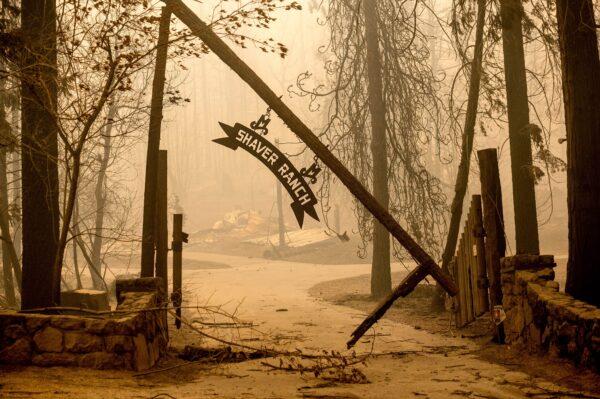 A sign hangs in front of a property along Highway 168 after the Creek Fire burned though Fresno County, Calif., on Sept. 8, 2020. (Noah Berger/AP Photo)
