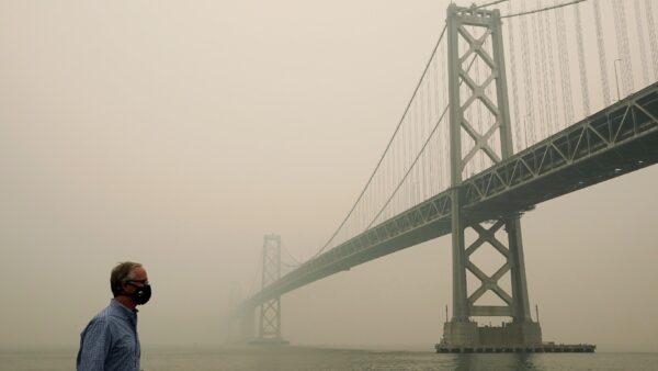Smoke and haze from wildfires partially obscures the view of the San Francisco-Oakland Bay Bridge along the Embarcadero in San Francisco, Calif., on Sept. 10, 2020. (Jeff Chiu/AP Photo)