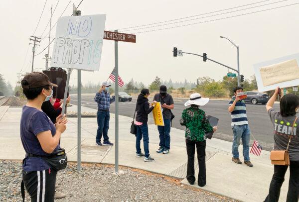 Cars pass protesters in front of Netflix’s headquarters in Los Gatos, Calif., on Sept. 11, 2020. (Ilene Eng/The Epoch Times).