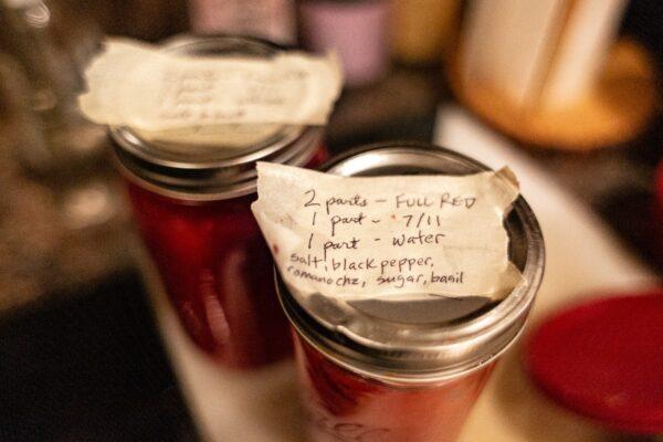 Jars of pizza sauce sit in Gene Pietrini's kitchen in Seal Beach, Calif., on Sept. 19, 2020. (John Fredricks/The Epoch Times)