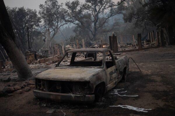 The remains of a vehicle and home are seen in the aftermath of the Glass Fire in Deer Park, Calif., on Sept. 28, 2020. (Adrees Latif/Reuters)