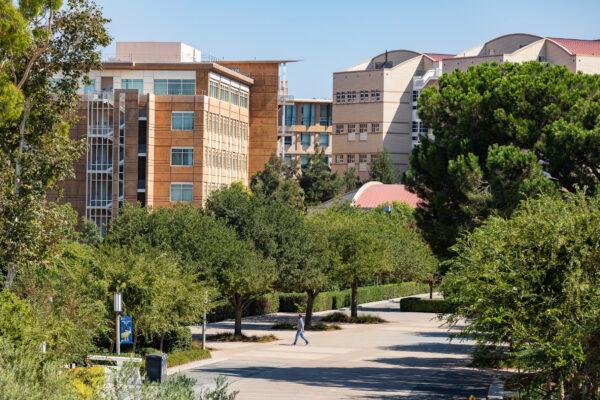 A student crosses a walkway on the UC Irvine campus in Irvine, Calif., on Sept. 25, 2020. (John Fredricks/The Epoch Times)