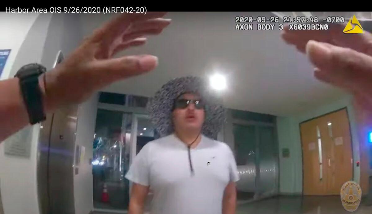 This photo from Los Angeles Police Officer Anthony Freeman's body-worn video shows the beginning of the attack by Jose Cerpa Guzman at the LAPD's Harbor Area station, on Sept. 26, 2020. (Los Angeles Police Department via AP)