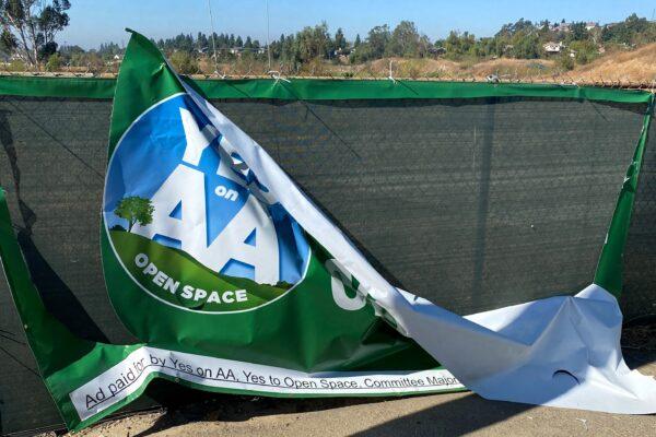 A sign in favor of Measure AA is vandalized in Orange, Calif., ahead of the Nov. 3, 2020 election. (Mark Moore)