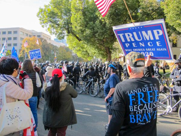 Police attend the rally to make sure civilians are safe in case protesters and counter-protesters clash at the “Stop the Steal” rally at California’s State Capitol in Sacramento on Nov. 14, 2020. (Ilene Eng/The Epoch Times)