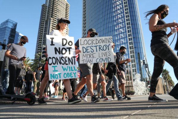 Business owners and others protest new COVID-19 regulations at the County Administration Building in San Diego, on Nov. 16, 2020. (Sandy Huffaker/Getty Images)
