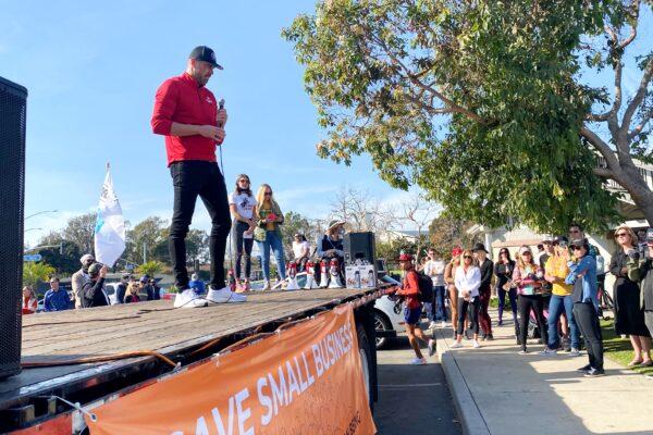 John Reed, owner of Newport Beach’s Bosscat Kitchen & Libations, speaks at a rally calling for the lifting of lockdowns on business in Newport Beach, Calif., on Dec. 13, 2020. (Jamie Joseph/The Epoch Times)