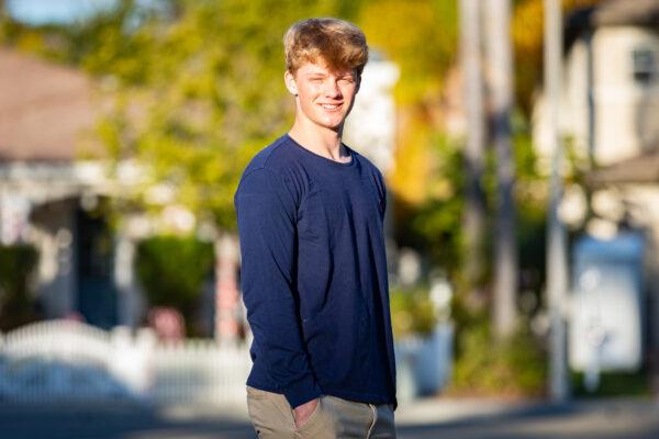 William Pugmire, who makes teddy bears for seniors, stands near his home in Carlsbad, Calif., on Dec. 29, 2020. (John Fredricks/The Epoch Times)