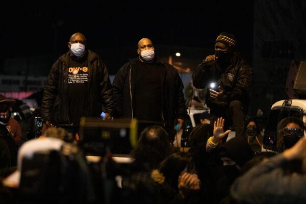 Men call on protesters to block Pastor Sean Feucht and his followers from reaching Skid Row's homeless with food, music, and worship, in Los Angeles on Dec. 30, 2020. (John Fredricks/The Epoch Times)