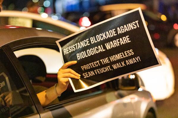 Cars block a section of 5th Street in the Skid Row area of Los Angeles on Dec. 30, 2020. (John Fredricks/The Epoch Times)