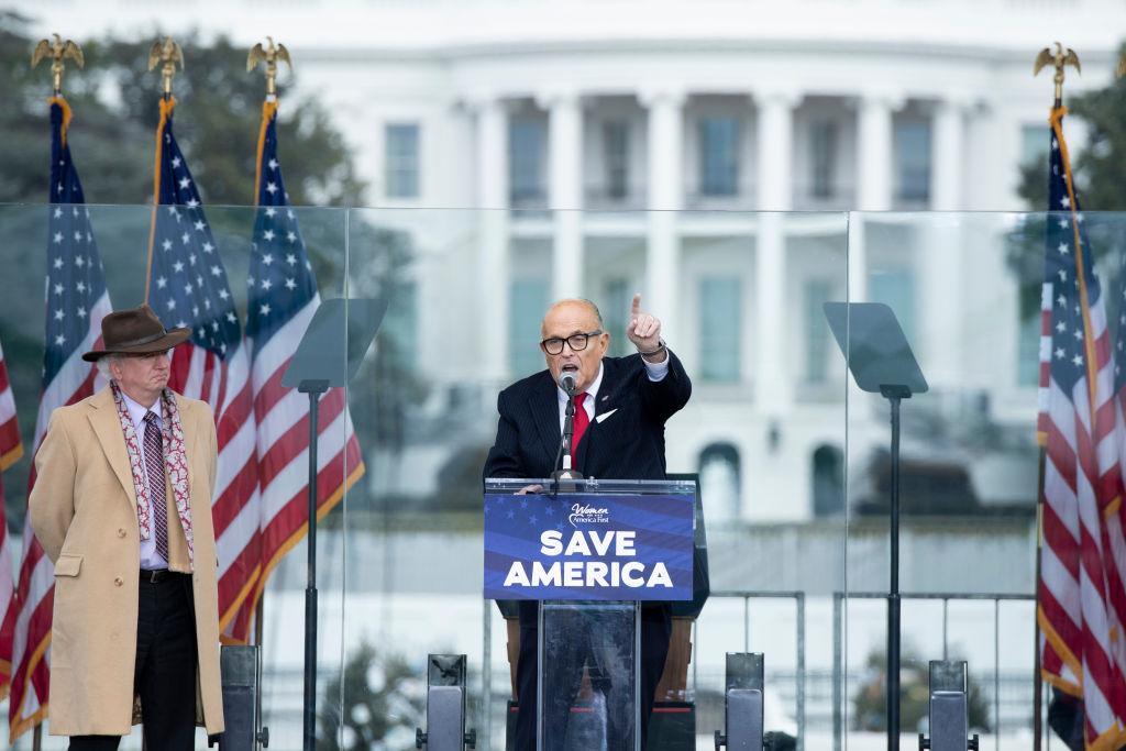 Chapman University law professor John Eastman (L) watches as Rudy Giuliani speaks to supporters from The Ellipse near the White House on Jan. 6, 2021. (Brendan Smialowski/AFP via Getty Images)